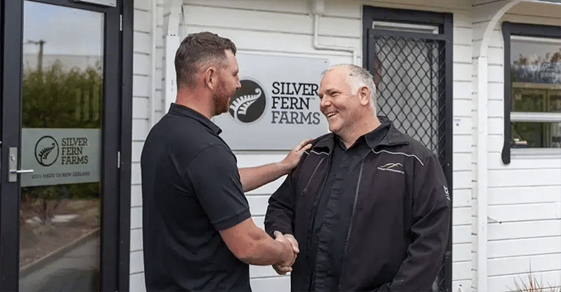 Silver Fern Farms Lead Engineer, Ethan Vincent, and Outback Communications Director Matt Alexander shake hands