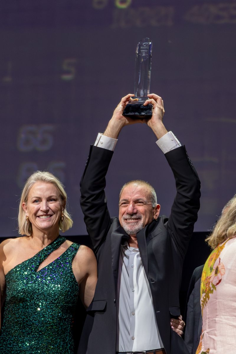 Tait Communications CEO Yoram Benit alongside Chief Legal Officer Penny Hoogerwerf raise the award in celebration