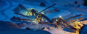 Overhead view of an openpit mine at night, a constantly changing environment
