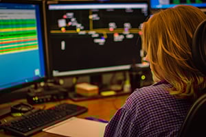 KCPL-Woman-looking-at-Dispatch_300x200